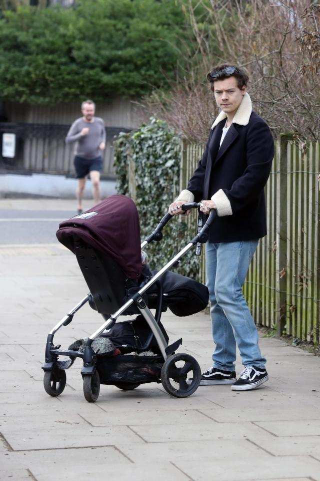  The singer looked like a natural as he took care of the baby