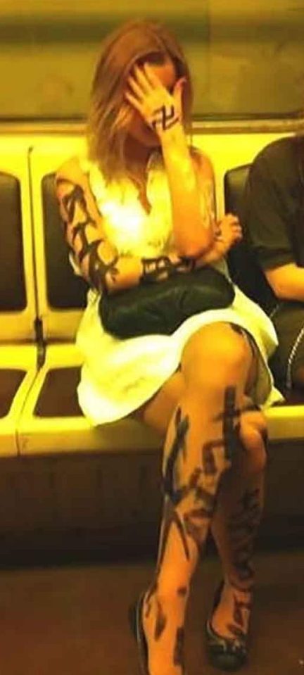  While one woman is stuck on a tube covered in black marker