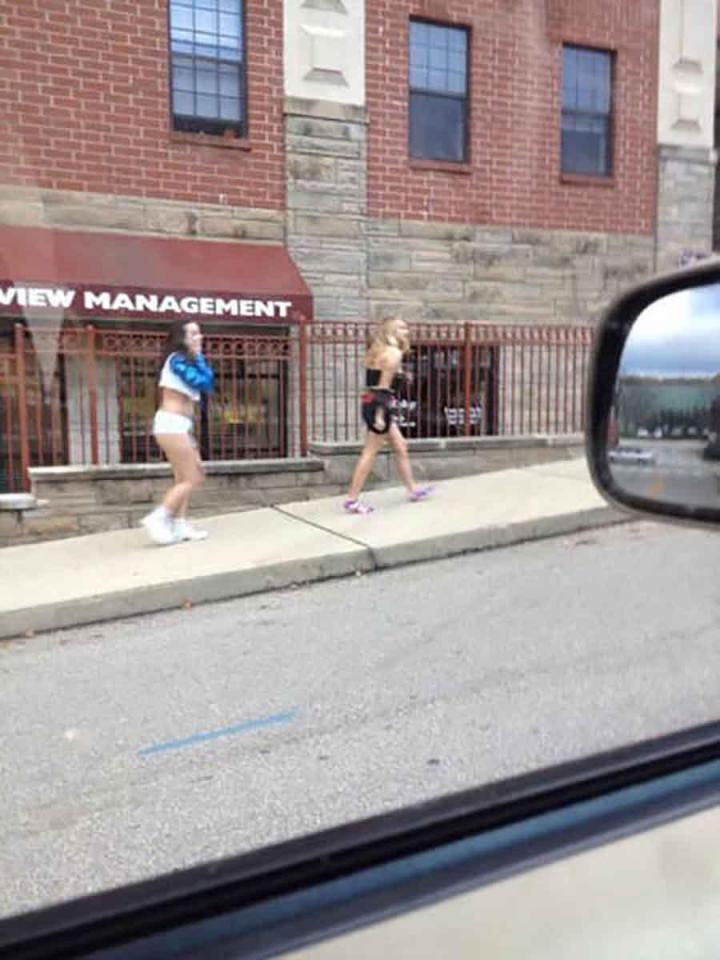  Two girls scarper home in hot pants and trainers.