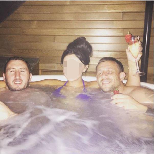  Stephen Pattison, left, and Karl Taylor, right, and a female companion in a hot tub