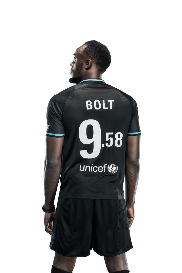  Jamaican speedster Usain Bolt wears a very special No9 shirt