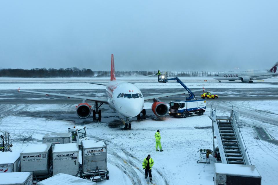  Edinburgh airport workers de-ice the wings of an Easyjet aeroplane following icy blasts from the East