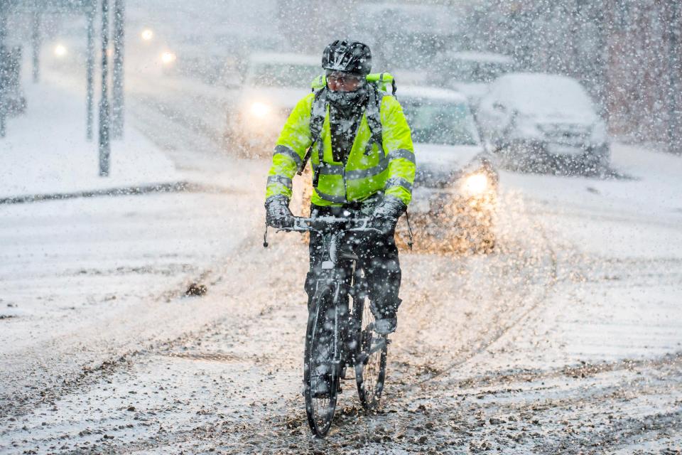  A cyclist attempts to navigate heavy snowfall in Leeds yesterday