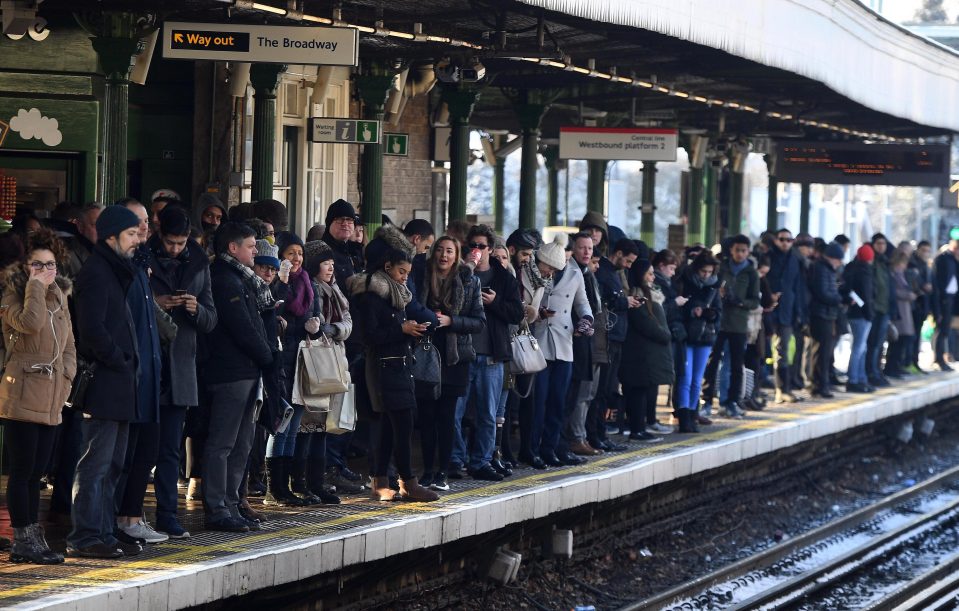  Commuters wait in the bitter cold at Woodford Station in North East London