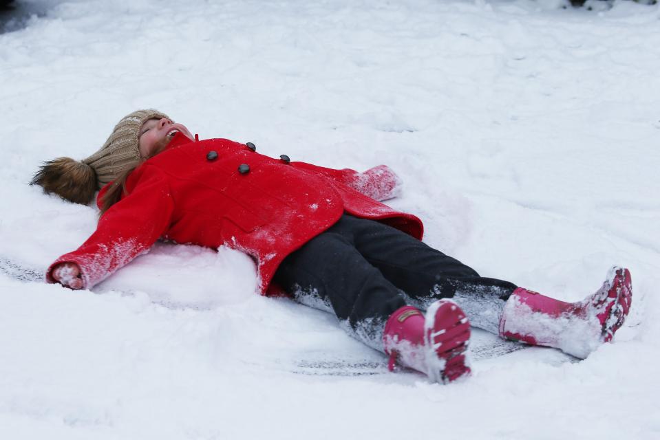  Five-year-old Poppy makes a snow angel in Leeds