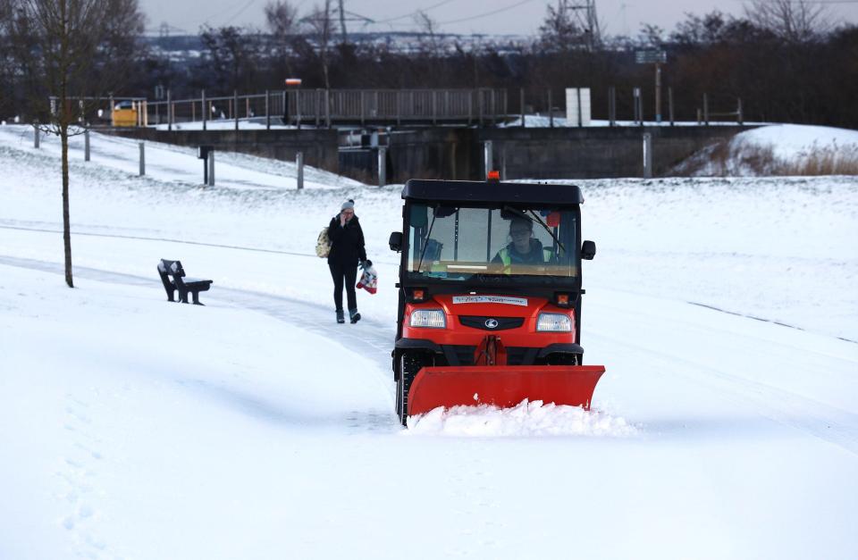  A small snow plough clears paths in Helix Park, Falkirk