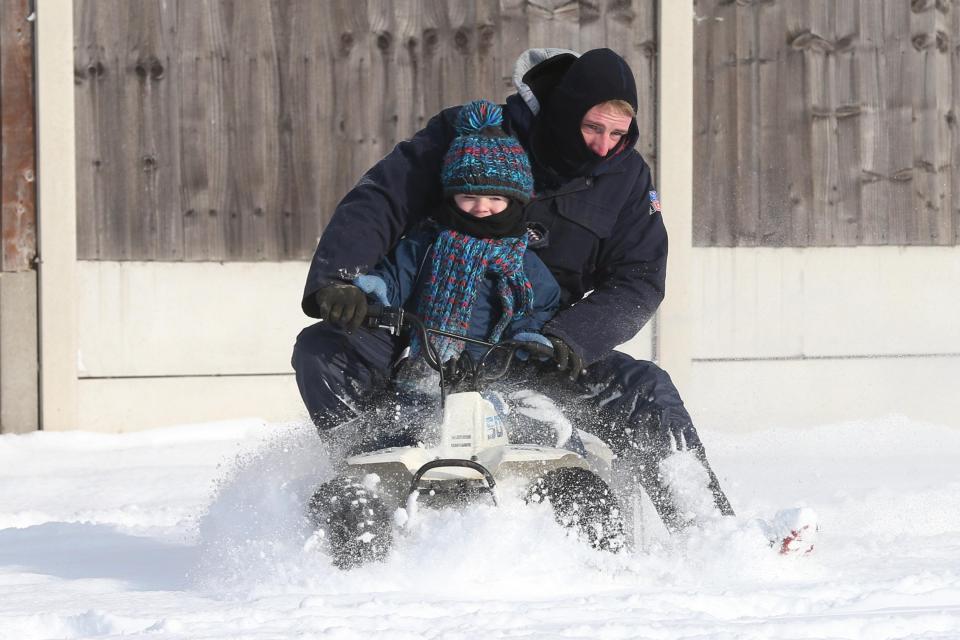  Residents of Canvey Island, just off Essex, make the most of the snow