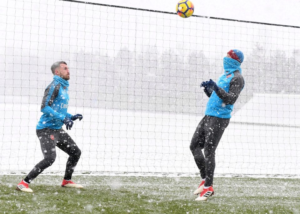  Gunners duo Aaron Ramsey and Mesut Ozil train in the snow ahead of the Citizens clash