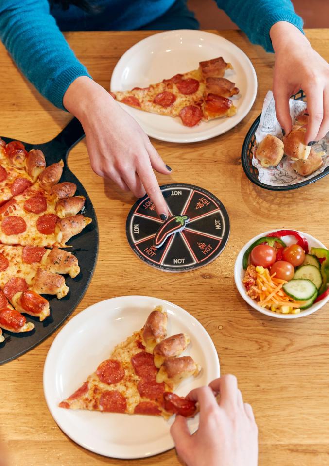  The hot or not spinner decides whether your next bite will be spicy or cheesy