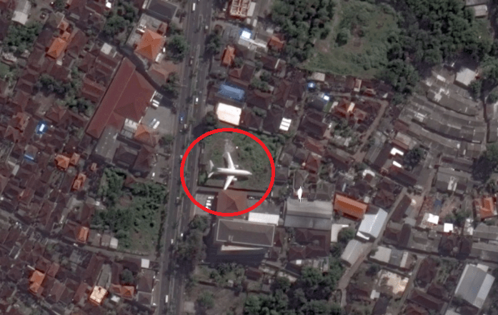  Bali has many abandoned planes including this one in Kedonganan next to a Dunkin' Donuts - the right wing covers a road