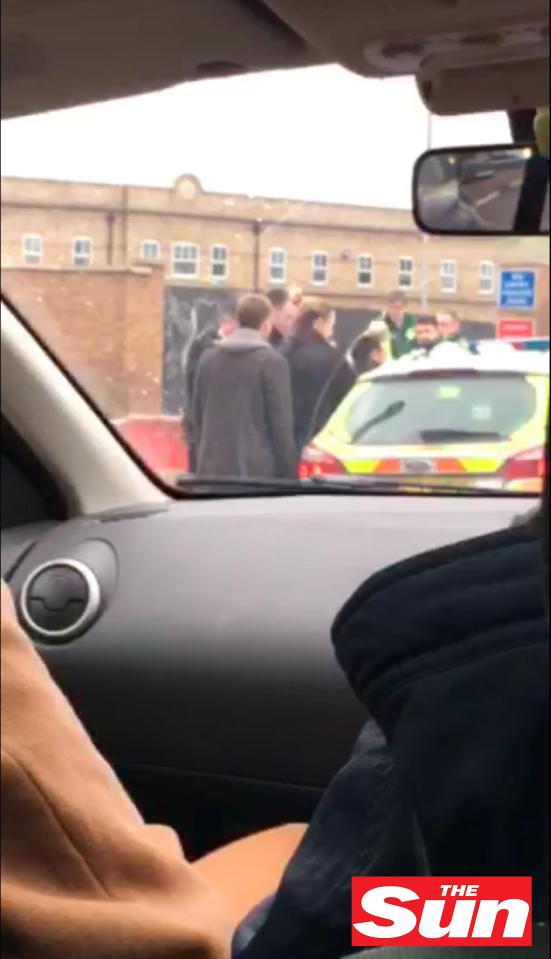  Ant is helped into the rear of a cop car