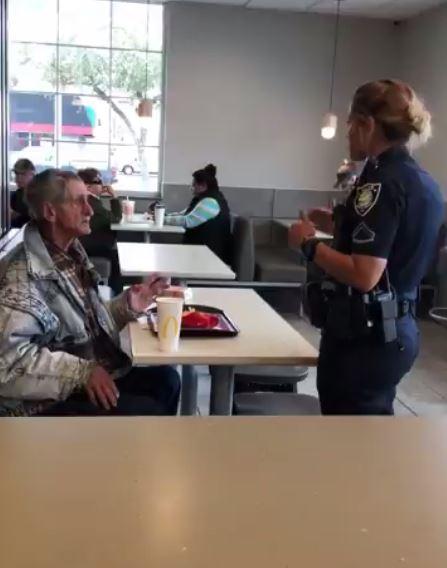  The police officer tells the homeless man that he once he finishes his food, he has to leave the restaurant and not come back