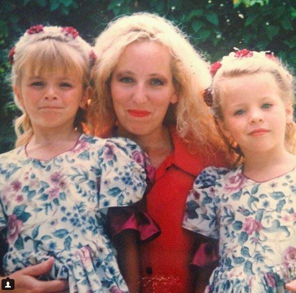  A six-year-old Lydia and five-year-old sister Georgia with mum Debbie