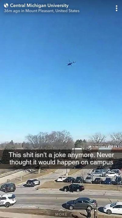  One student snapped the police helicopter overhead as they said they 'never thought' this would happen on campus