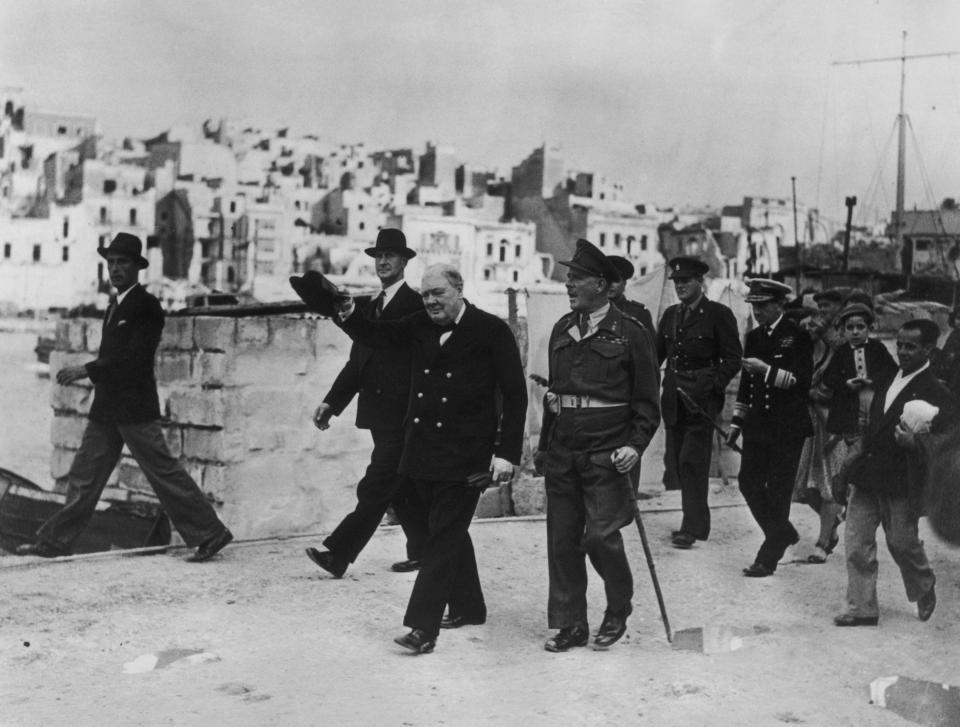  Sir Winston Churchill walks through the dockyard in Malta in 1945