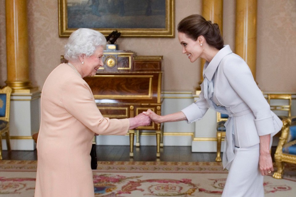 Angelina Jolie wore the outfit as Queen Elizabeth made her an honorary dame