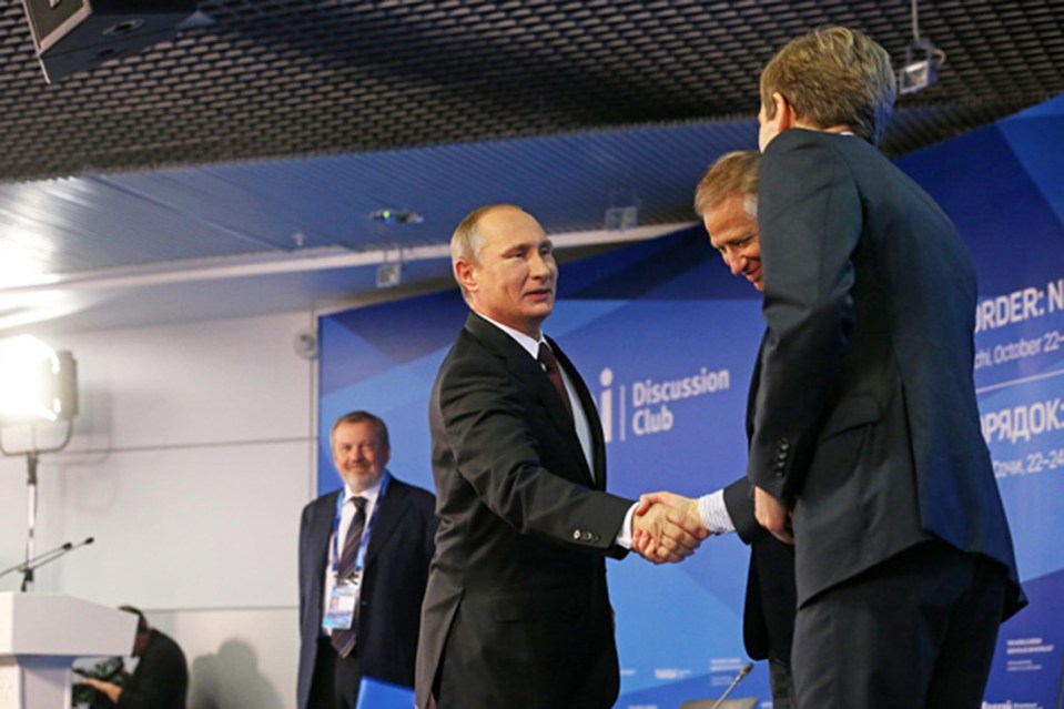 Seumas Milne pictured shaking hands with Vladimir Putin in Sochi