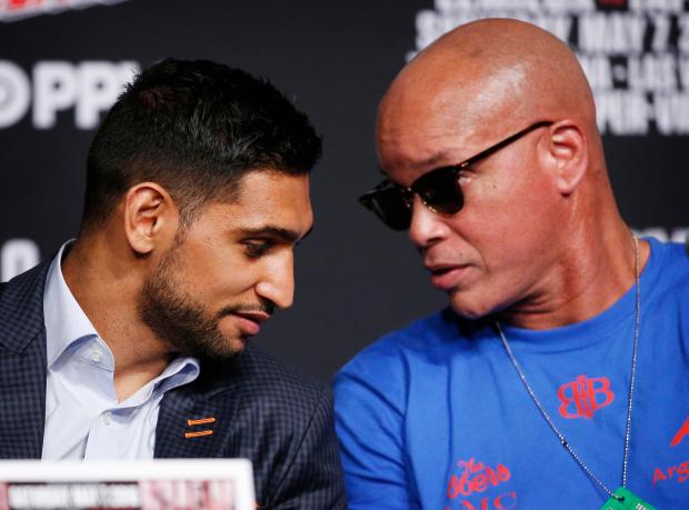 Amir Khan has taken on a new trainer after long-time coach Virgil Hunter was taken to hospital with illness