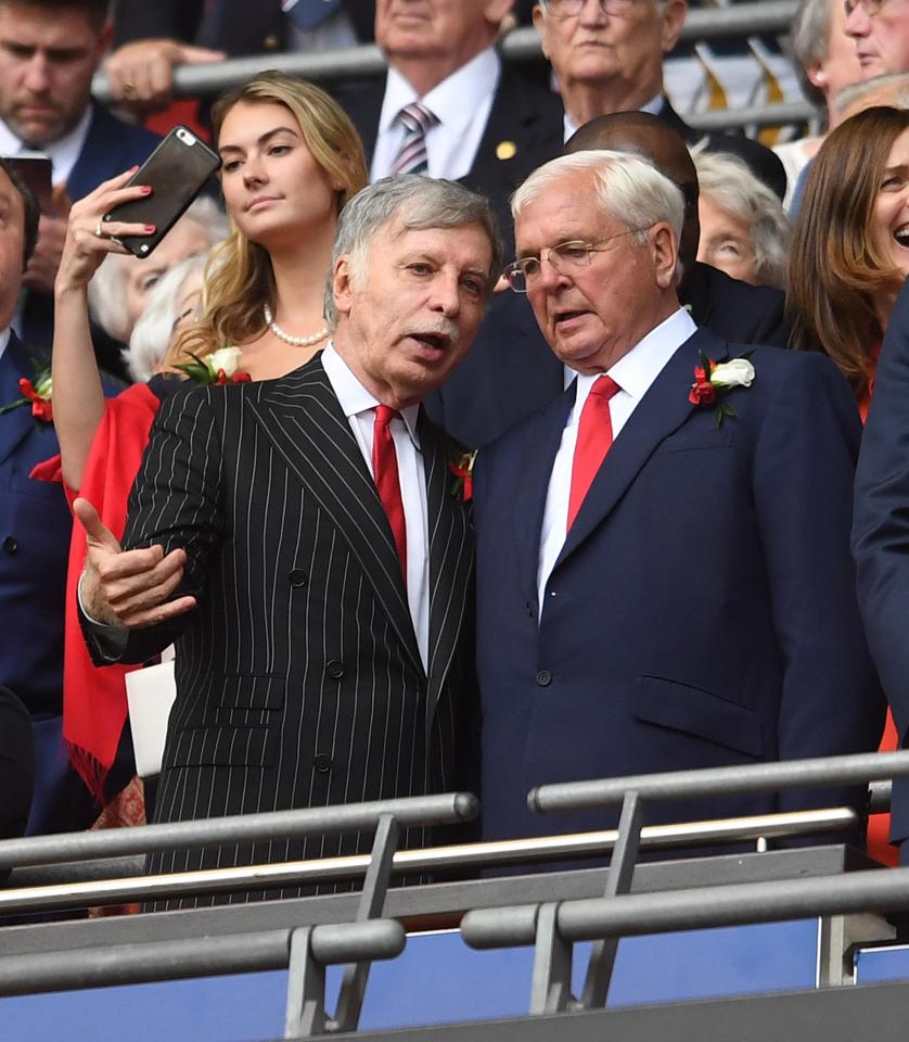  Stan Kroenke, left, will have the final say on Arsene Wenger's future