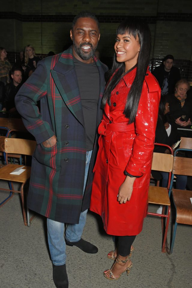  Idris Elbas finacee Sabrina Dhowre wore a bold red mac to the Burberry show at London Fashion Week