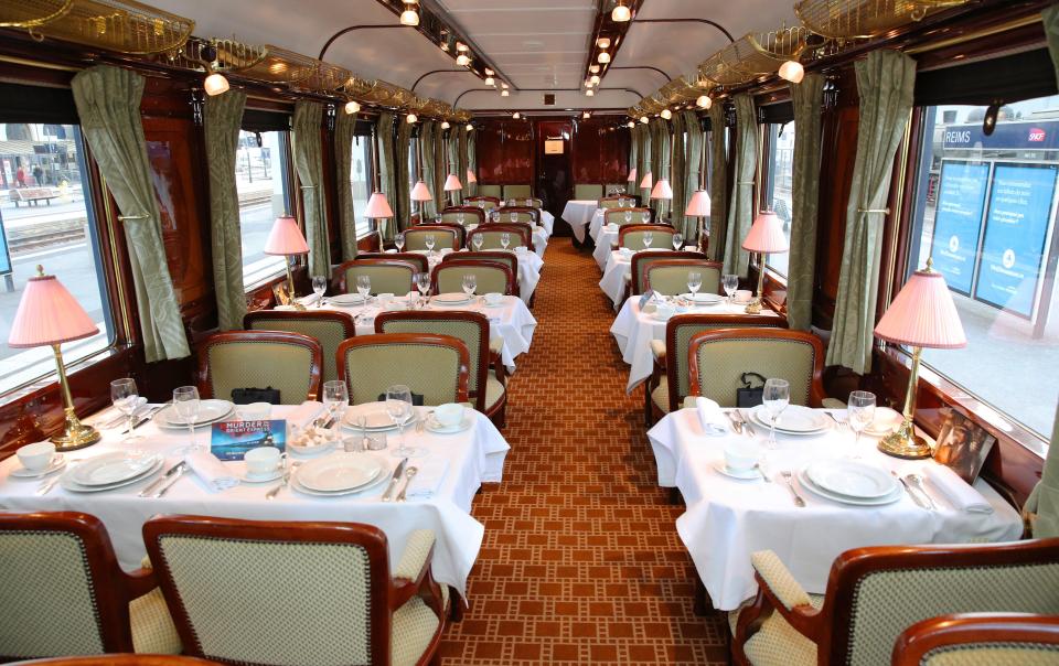  Dine in style in the softly lit dining car kitted out with fine white linen and silverware