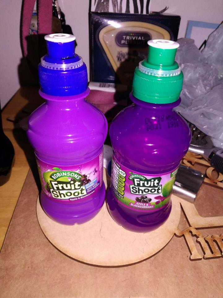  Parents have claimed Robinson's latest Fruit Shoot bottle, pictured on the right with the green bottle, has made their kids sick