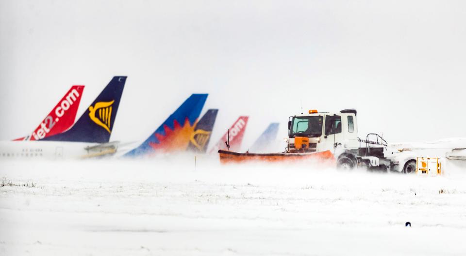  Snow is cleared at Leeds Bradford Airport, which has faced another set of cancellations