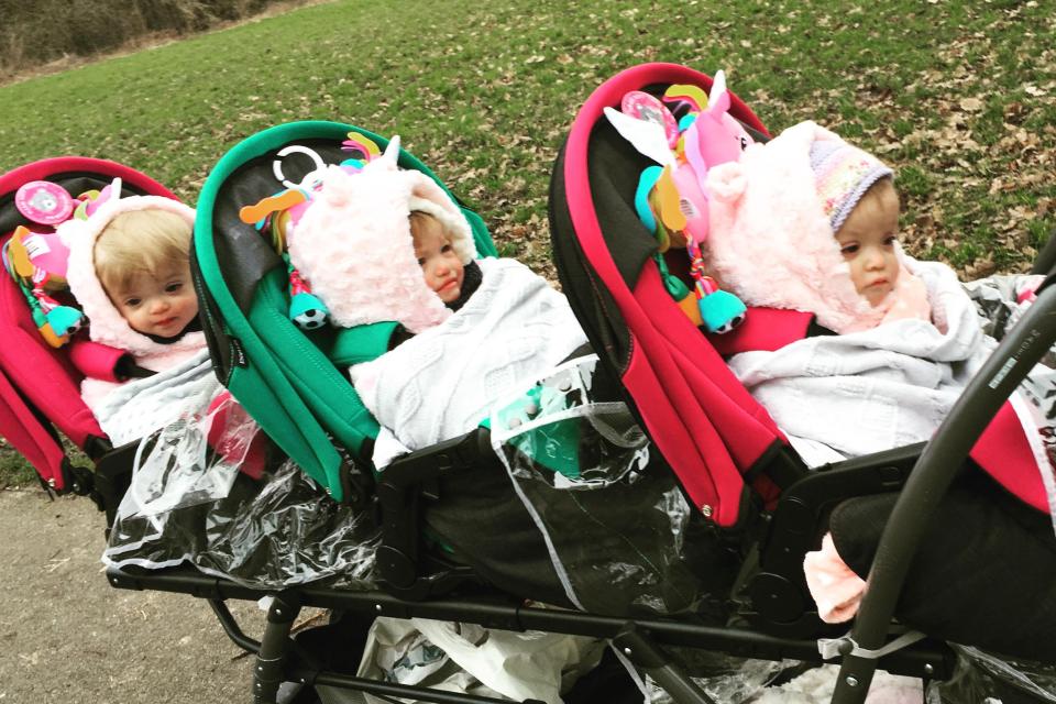  The Wooldridge triplets enjoying a day out in their really long buggy and matching outfits