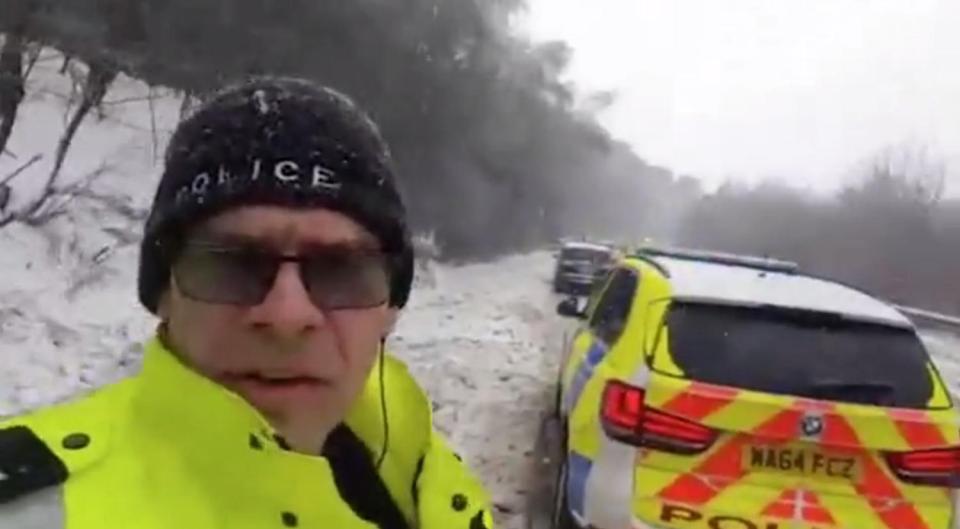  Police at the scene of the 40-car pile up in Devon