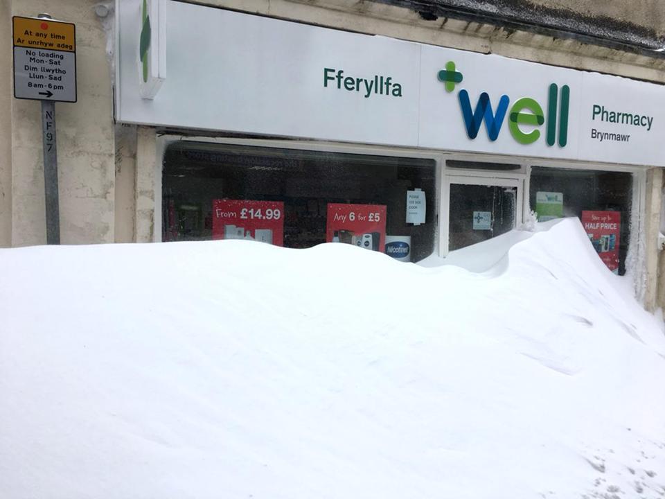  Shop fronts blocked have been blocked in by snow drifts in Brynmawr, South Wales after being hit by Storm Emma