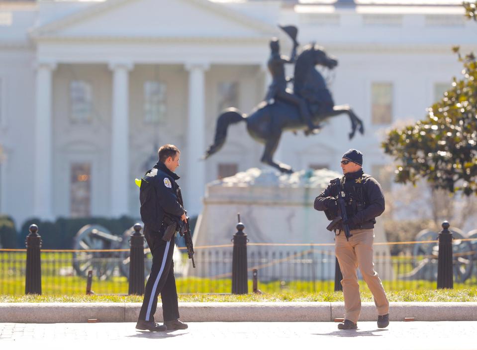  Law enforcement officers at Lafayette Park across from the White House in Washington, close the area to pedestrian traffic