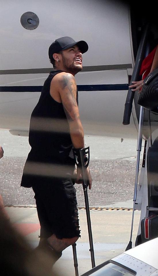  Neymar is seen using crutches after undergoing surgery on his foot