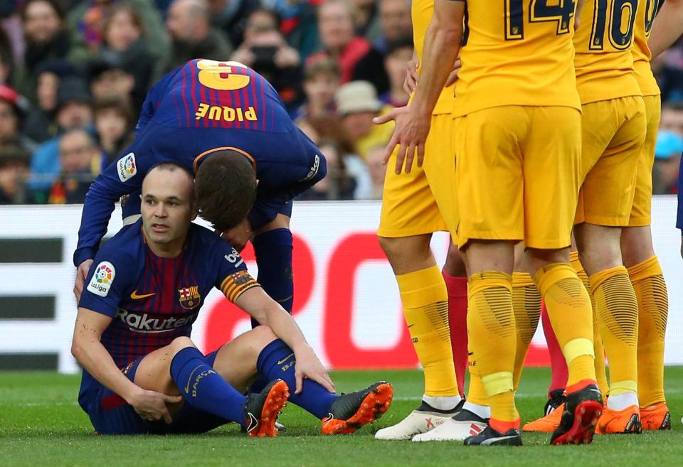  Barcelona’s Andres Iniesta is down after sustaining an injury