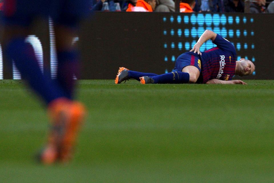  Andres Iniesta injured during match between Barcelona and Atletico Madrid at Nou Camp stadium.