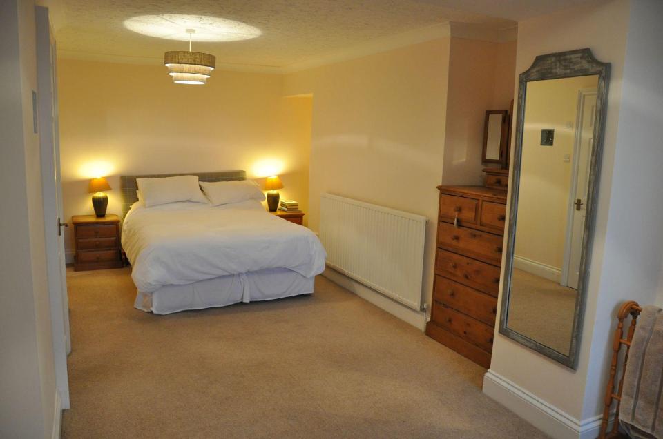  Pictured above is one of the property's three bedrooms