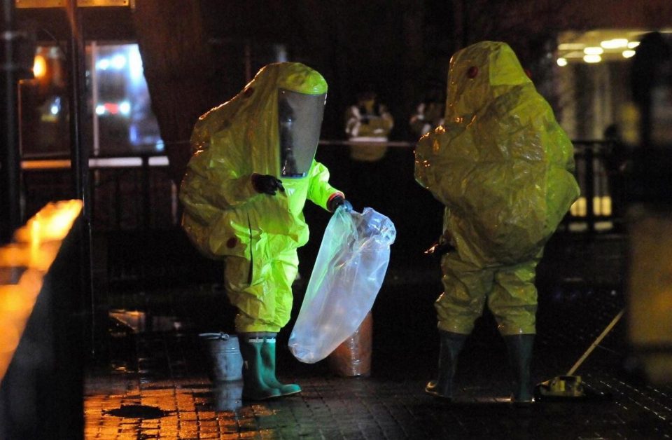  Investigators in protective hazchem suits examine the scene where Skripal was found collapsed in Salisbury