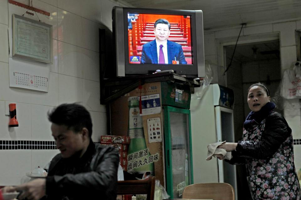  The terrifying scheme will become mandatory in 2020. File picture showing President Xi on a television in a Shanghai restaurant