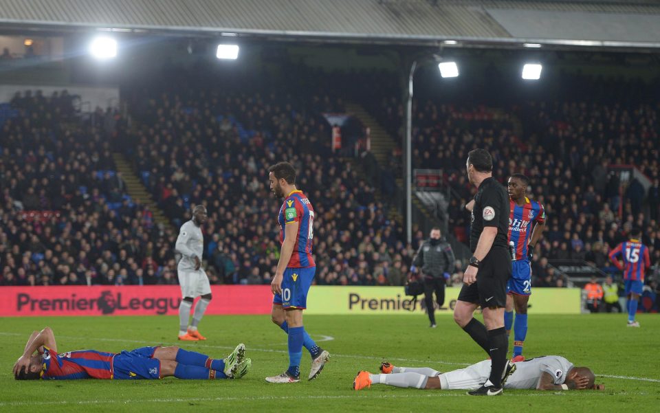 Luka Milivojevic of Crystal Palace and Ashley Young of Manchester United both required medical attention