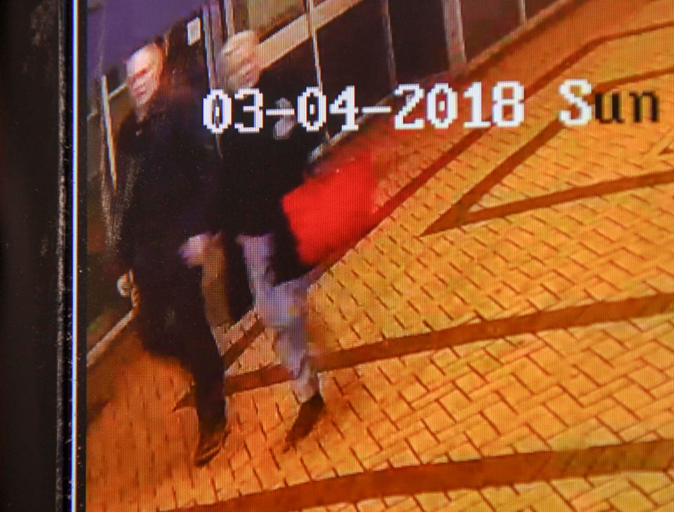  CCTV shows a woman holding a red handbag minutes before Russian spy Sergei Skripal was found poisoned