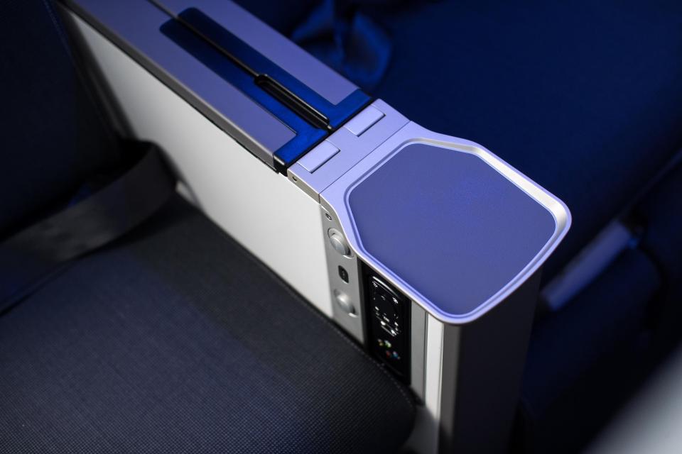  Premium economy seats are getting a cocktail holder