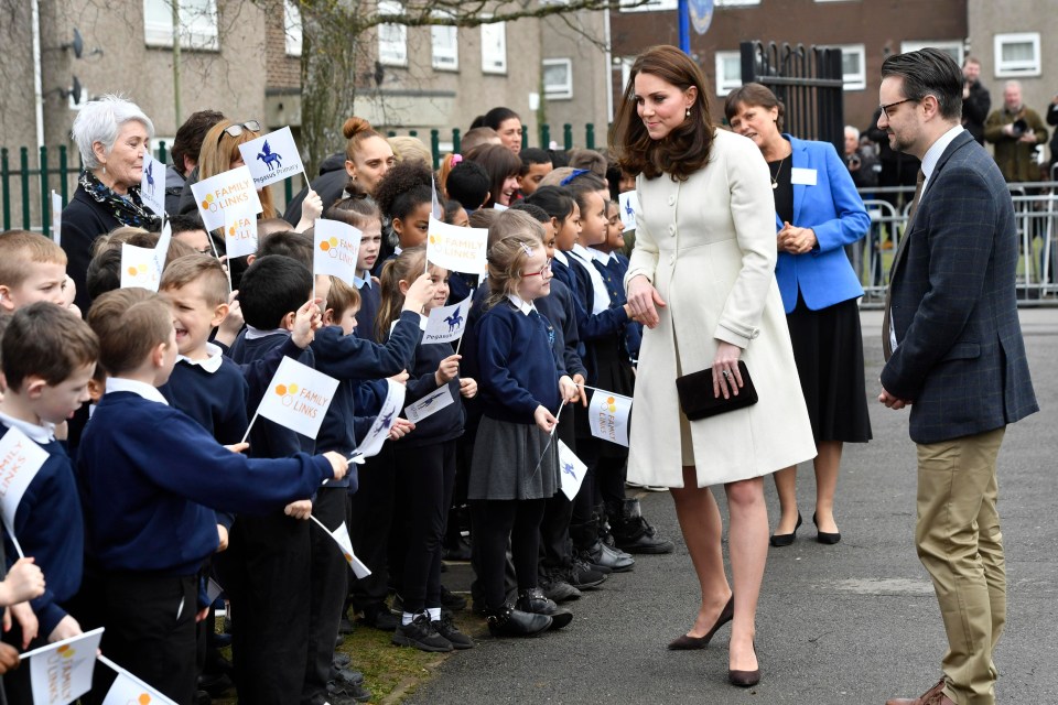 Children waved flags as Kate arrived at Pegasus Primary School