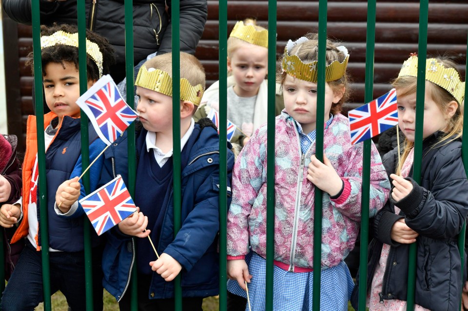 Oxford schoolchildren pictured waiting for the Duchess of Cambridge to arrive