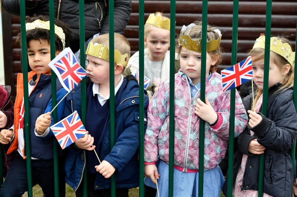  Oxford schoolchildren pictured waiting for the Duchess of Cambridge to arrive