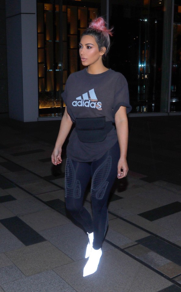 Kim Kardashian went for a sporty look, with a T-shirt and bright white boots