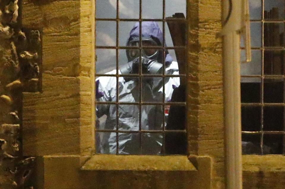  Officers were seen wearing protective suits and masks to search The Mill pub