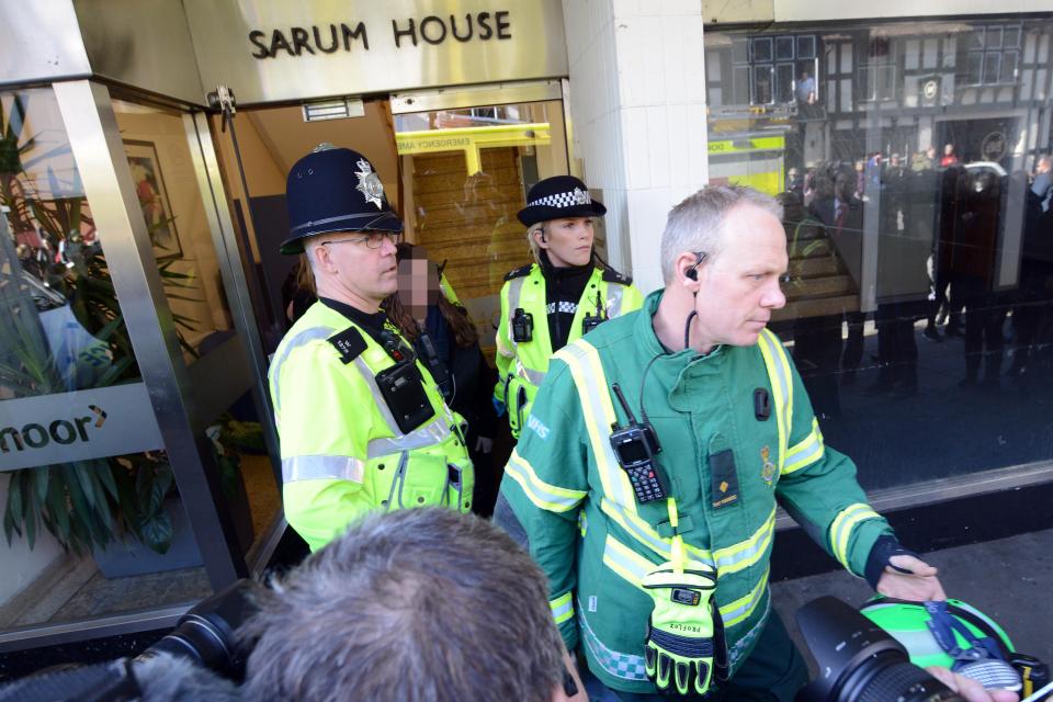  The pair, who looked shocked by what was happening, were surrounded by police and paramedics