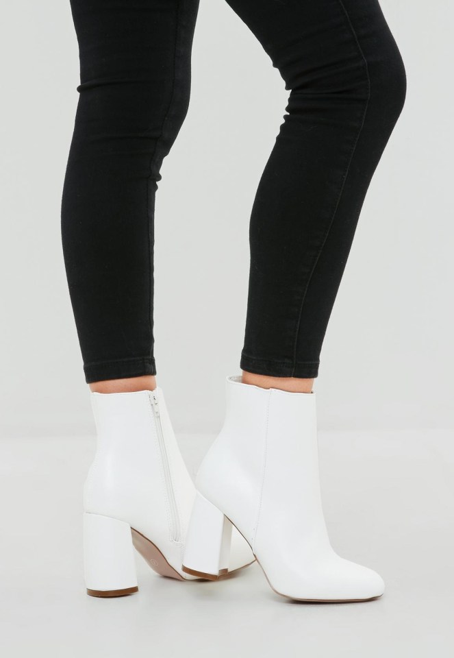 Simple white boots can look great with black jeans for a sleek monochrome look