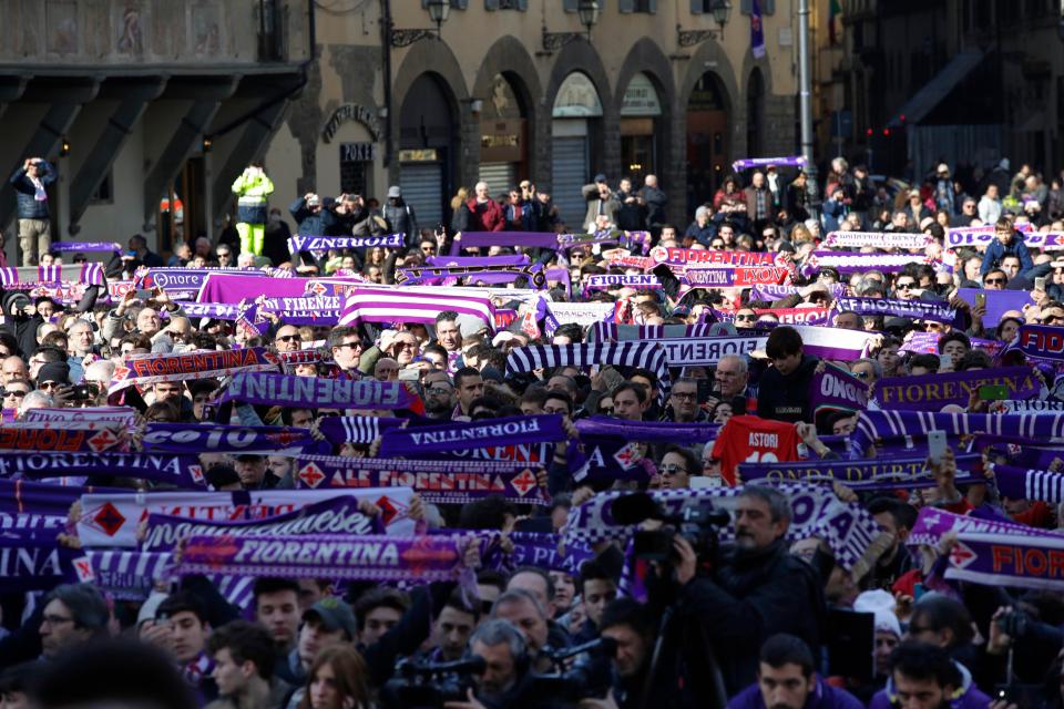 Thousands of Fiorentina fans gathered near the church holding their club scarves in their famous purple