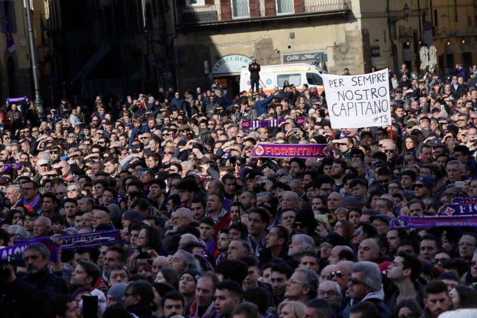 One banner read 'forever our captain' as thousands of supporters stood near the church in the centre of Florence