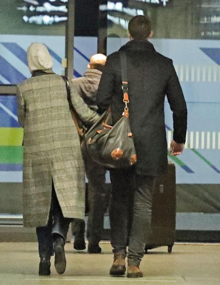  The pair even locked arms as they made their way out of a London train station